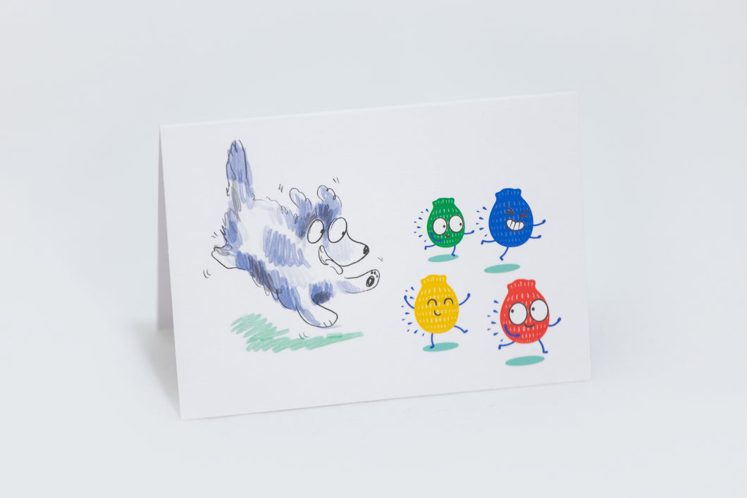 Greeting card with a cartoon of a happy dog chasing 4 different coloured EcoSplat reusable water balloon characters. Red, blue, yellow and green